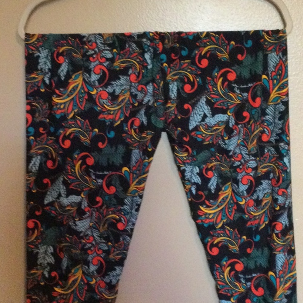 Brand new Lularoe Leggings, size TC, floral pattern with orange, blue, black